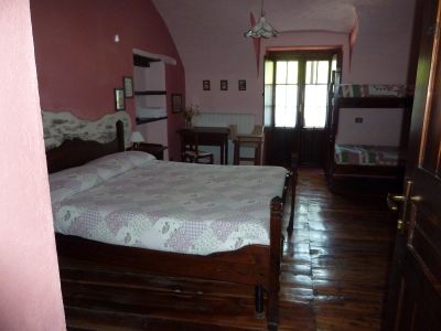 Eines der Zimmer im Posto Tappa in Ponte Maira